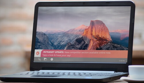 laptop displaying intranet update ticker